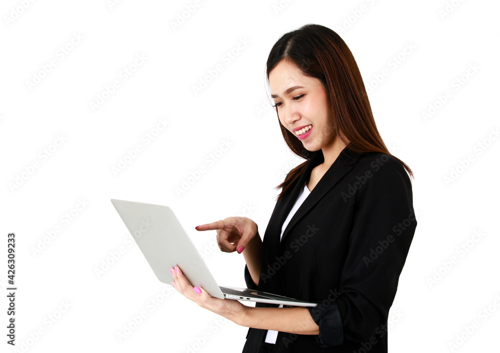 Asian young long brown hair successful businesswoman lawyer wears black formal suit stand smile look at screen hold silver laptop in hand use index finger point at monitor in front white background Asian young long brown hair successful businesswoman lawyer wears black formal suit stand smile look at screen hold silver laptop in hand use index finger point at monitor in front white background