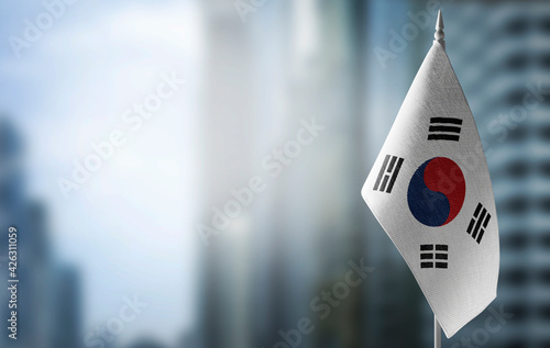 Fotografie A small flag of South Korean on the background of a blurred background