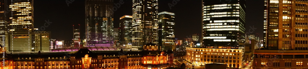 Tokyo Station and skyscraper at night in Tokyo, Japan. Panoramic view - 東京駅 夜景 日本 パノラマ Tokyo Station and skyscraper at night in Tokyo, Japan. Panoramic view - 東京駅 夜景 日本 パノラマ