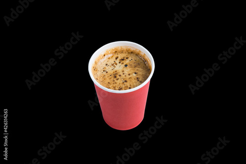 Coffee to go in a paper cup without a lid on a black background copy space top and side view