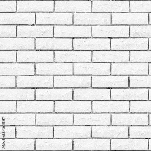 Seamless texture White Brick with gnawed and chipped surfaces. Tiling clean for background pattern. Rectangle mosaic tiles wall high resolution. Old or artificially aged in production