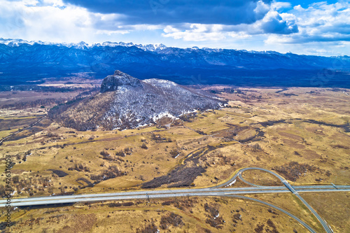 Lika region. Zir hill and Velebit mountain in Lika landscape view. A1 highway
