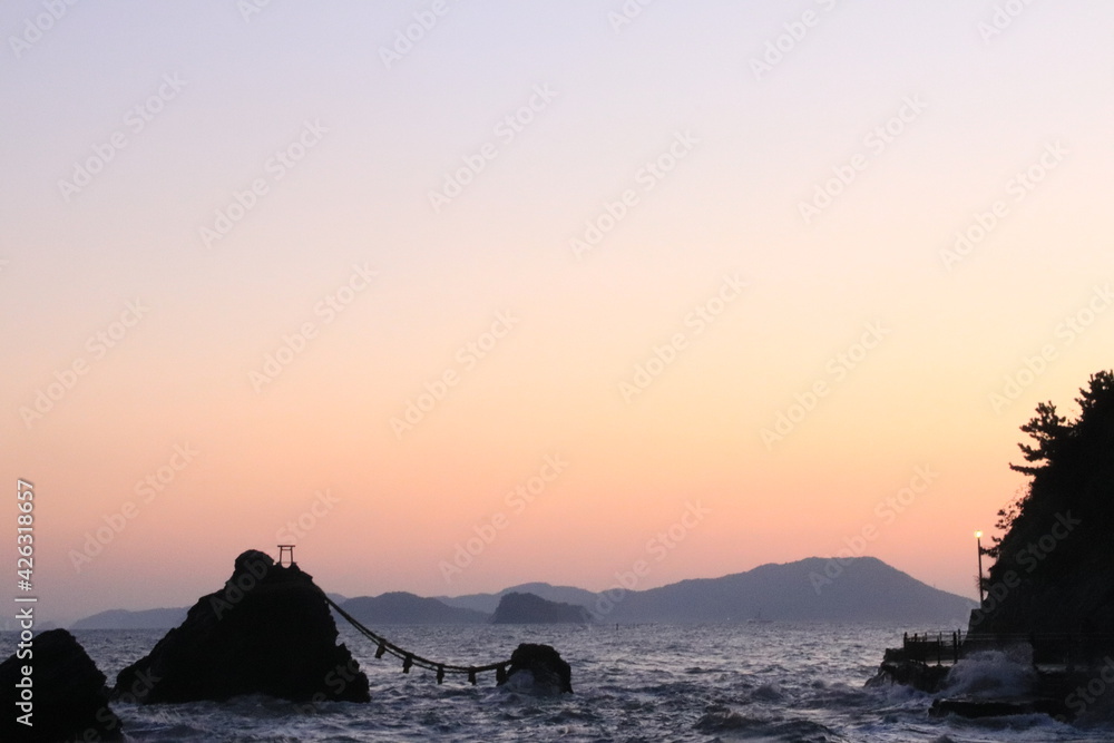 Beautiful orange ocean sunrise and isolated rocks (Married couple rocks in Mie Prefecture) /日の出の夫婦岩(三重県)