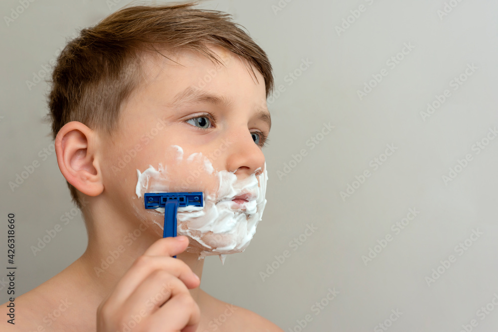 The baby with the shaving foam decided to shave for the first time