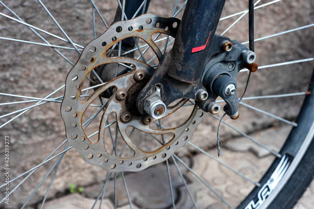 Brake discs on the front wheel of a bicycle, close-up. Brake discs on the front wheel of a bicycle, close-up.