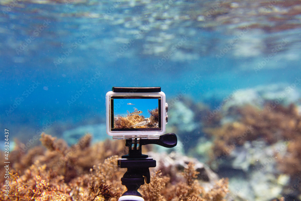 Using action-camera in waterproof box to make photos and video underwater