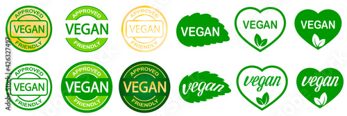 Set of vegan stamps. Plant based vegeterian food product label. Green round and heart-shaped stamp. Logo or icon.