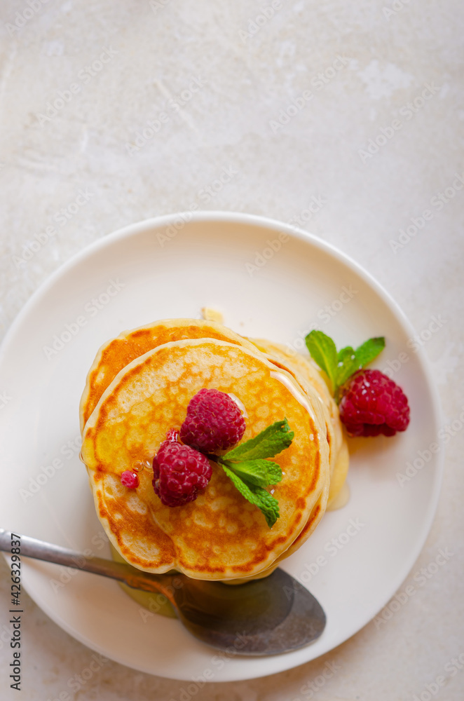 Delicious fluffy golden pancakes. Great idea for a sunny summer breakfast. A great treat for children. Delicious fluffy golden pancakes. Great idea for a sunny summer breakfast. A great treat for children.