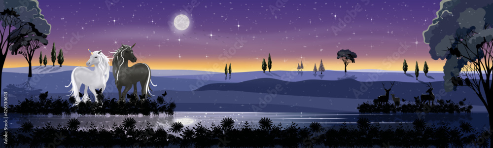 Panorama landscape in winter night with full moon, misty covered wavy mountains with Unicorn and reindeers family standing by the lake, beautiful landscape view for holiday background