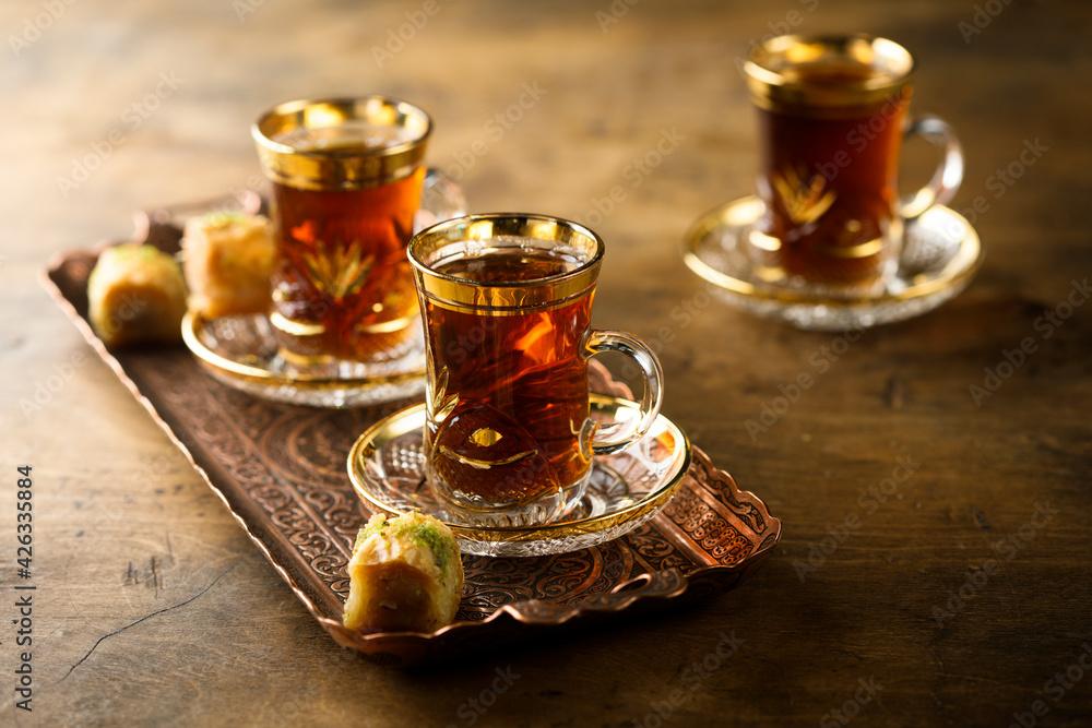 Traditional Turkish tea served with sweets - obrazy, fototapety, plakaty 