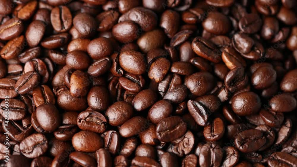 many coffee beans in a close up filmed with motion many coffee beans in a close up filmed with motion