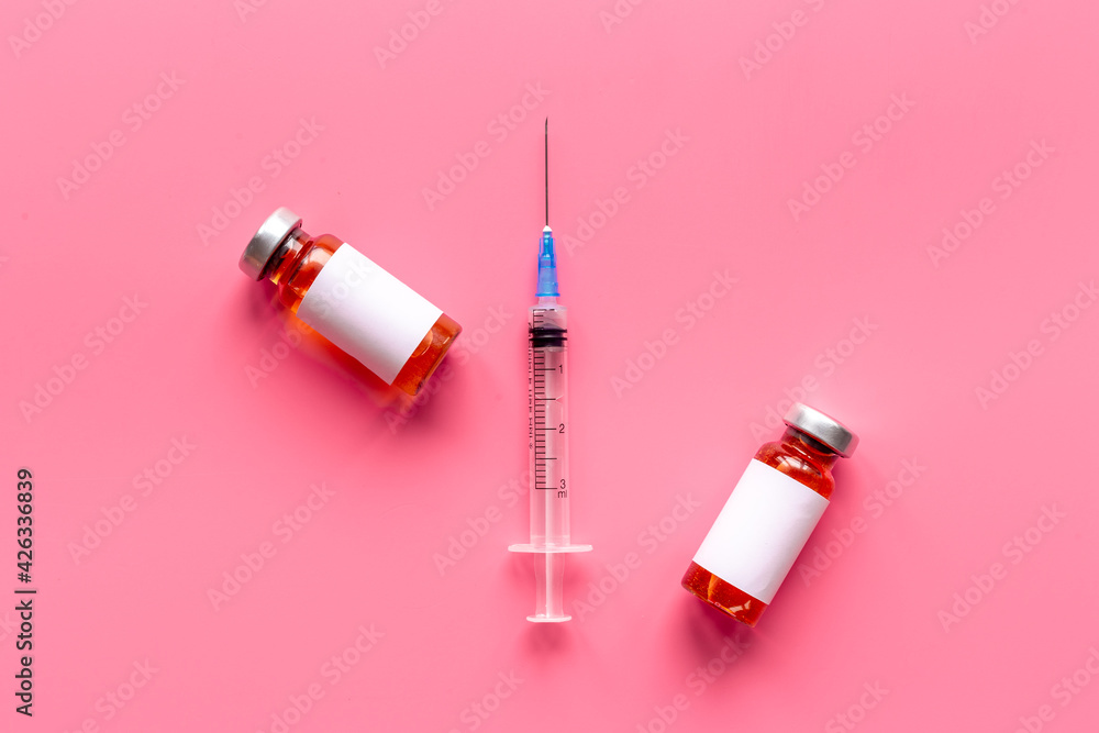 Coronavirus vaccine ampoules with syringe. Vaccination concept Coronavirus vaccine ampoules with syringe. Vaccination concept