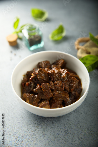 Traditional homemade beef goulash in a white bowl