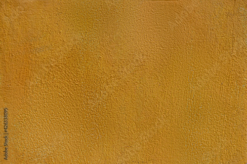 Rough yellow concrete wall background, dirty yellow background