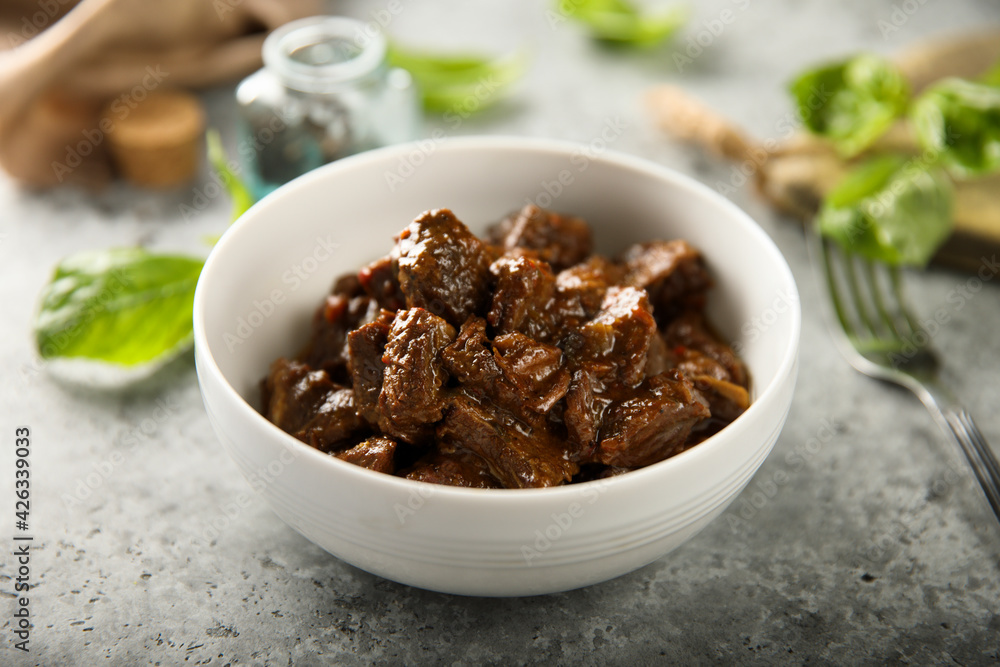 Traditional homemade beef goulash in a white bowl Traditional homemade beef goulash in a white bowl