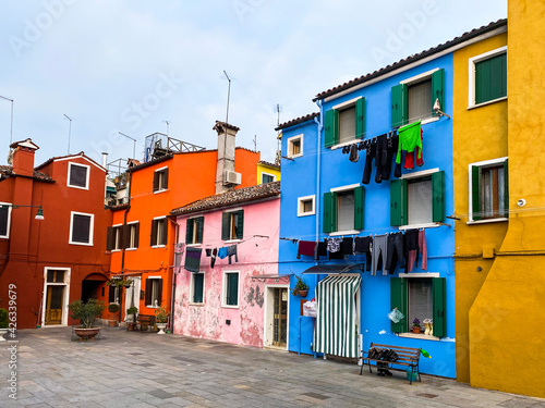 Colorful houses on a small traditional square at Burano island, Venice, Italy © Eric Isselée