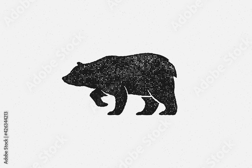 Black silhouette of bear as symbol of wild fauna in nature hand drawn stamp effect vector illustration