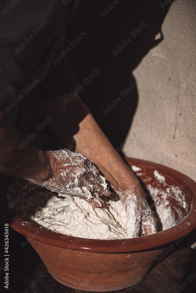 Woman Chef Making Fresh Handmade Bread in Old Oven Woman Chef Making Fresh Handmade Bread in Old Oven