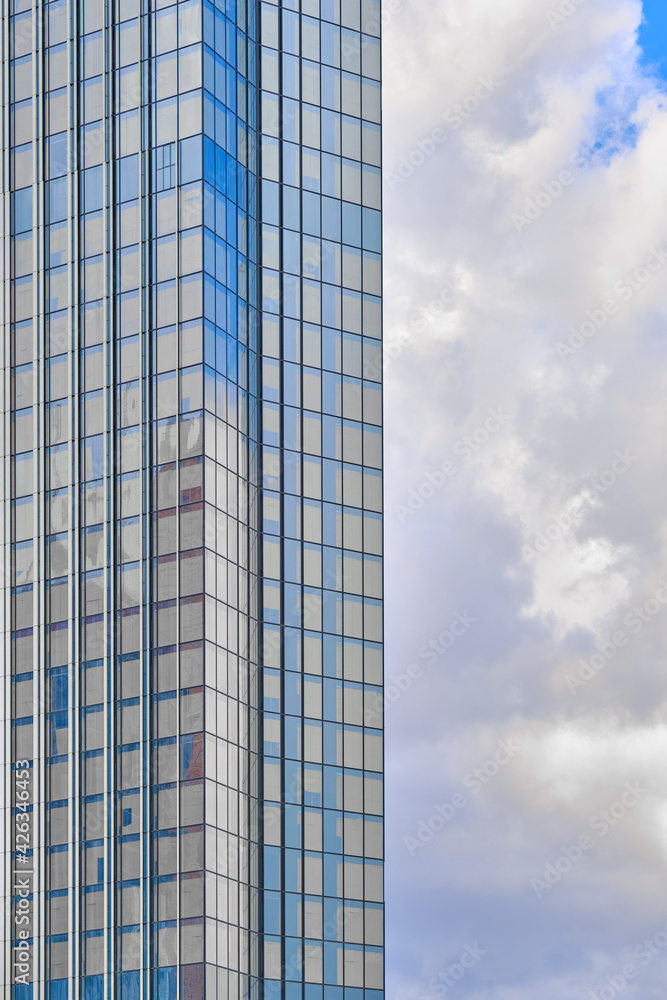 Architecture fragment of a skyscraper on the background of the sky. Business background Architecture fragment of a skyscraper on the background of the sky. Business background