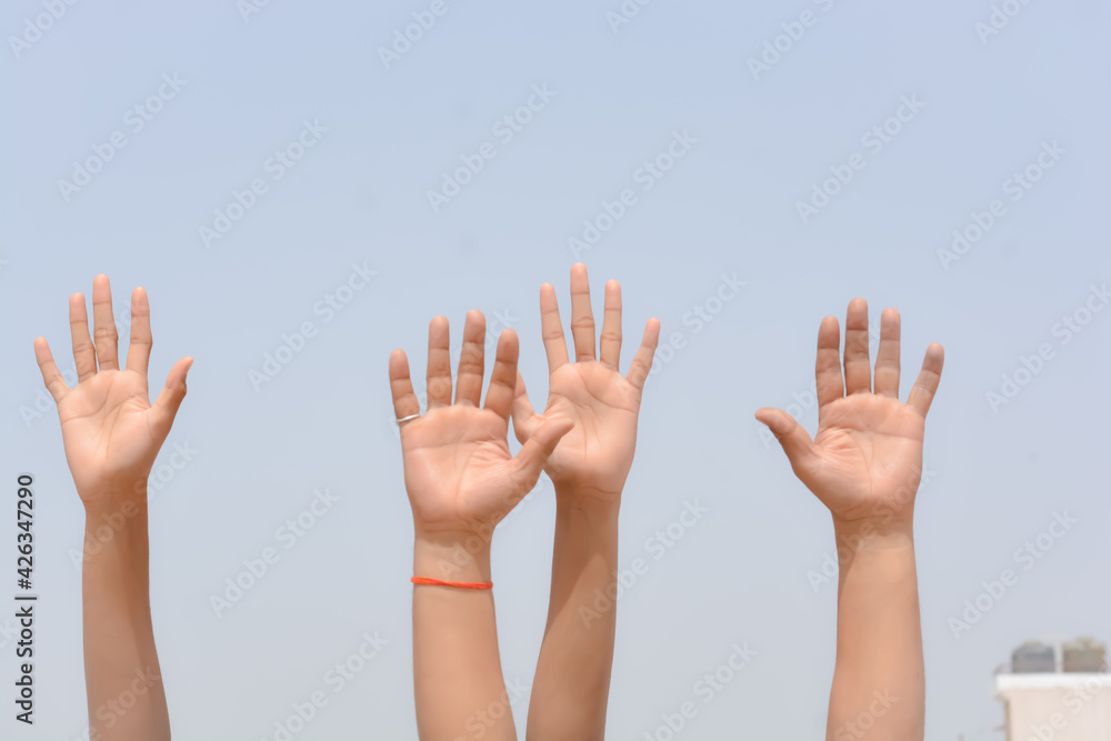 Raise hand in sky background
