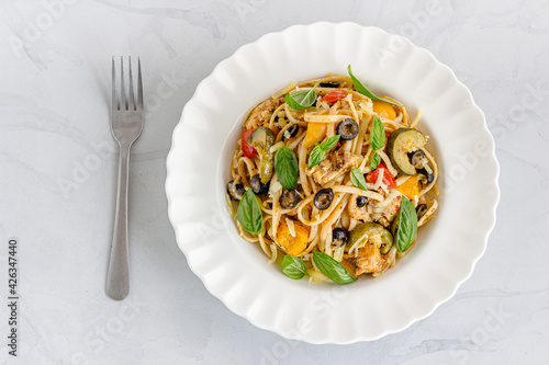 Summer Pasta with Bell Pepper, Zucchini, Olive and Chicken in a Bowl Top Down Photo
