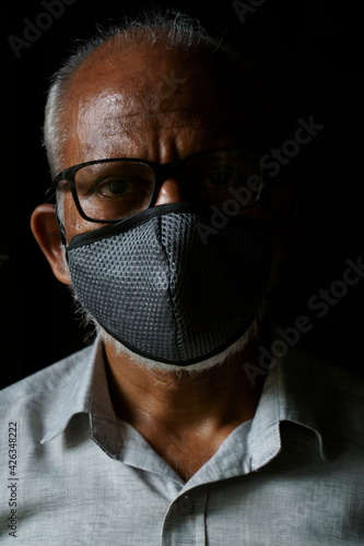 Portrait of 60 years old Indian man wearing mask (ID: 426348222)
