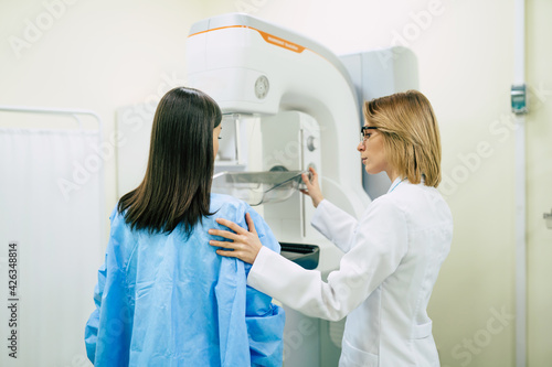 Young woman is having mammography examination at the hospital or private clinic with a professional female doctor. photo