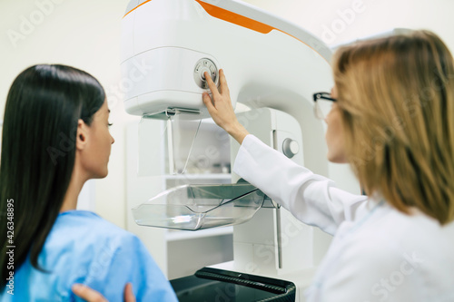 Young woman is having mammography examination at the hospital or private clinic with a professional female doctor.