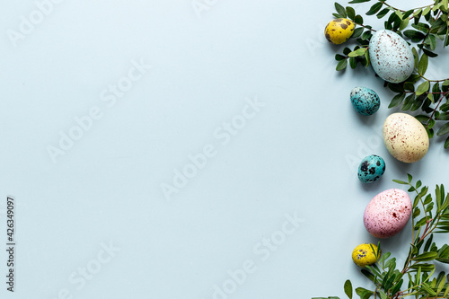 Photography Easter decoration concept with eggs with spring branches and green leaves