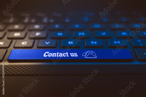 Contact us conecpt on keyboard key. Email and phone call icon