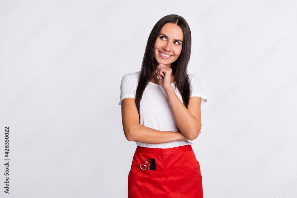 Photo of young attractive woman happy positive smile think look empty space hair stylist isolated over white color background Photo of young attractive woman happy positive smile think look empty space hair stylist isolated over white color background