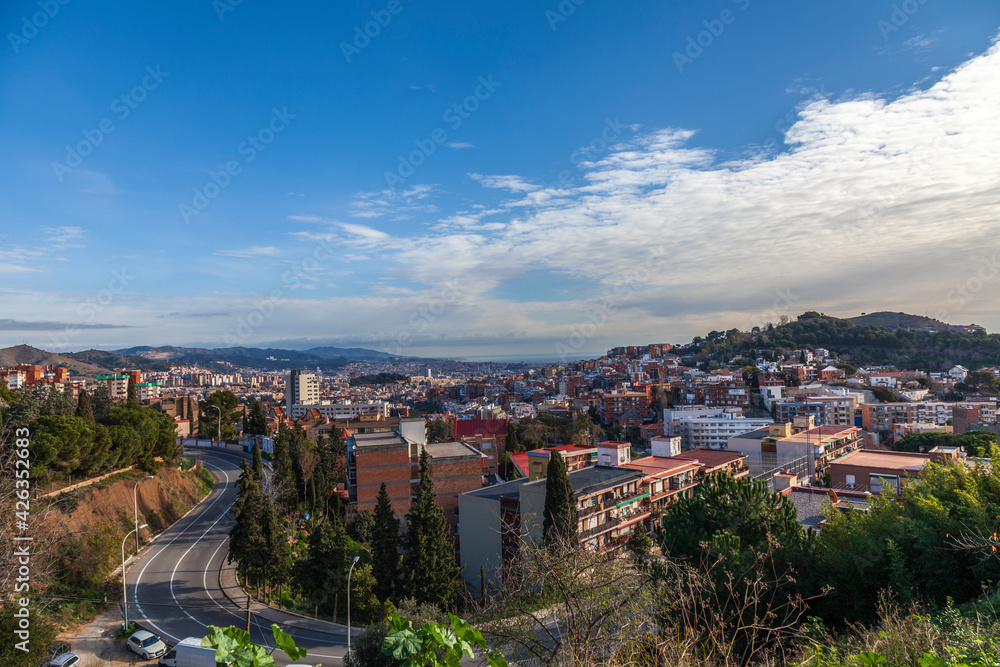 Panorama of Barcelona from Mount Tibidabo. Early morning in the outskirts of Barcelona. Landscape overlooking the outskirts of the city. View from the mountain to the city in the morning.