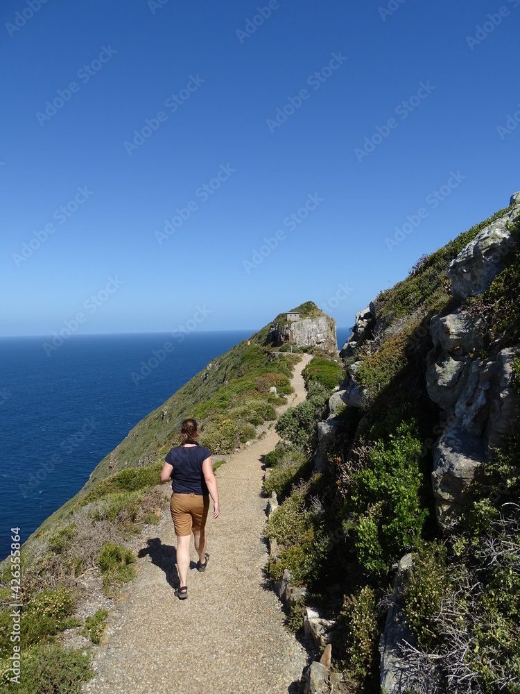 cape of good hope in south africa, a woman hiking on a path