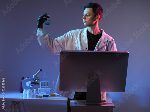 Chemist with a test tube. M...