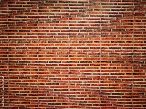 Red brick wall close up texture.