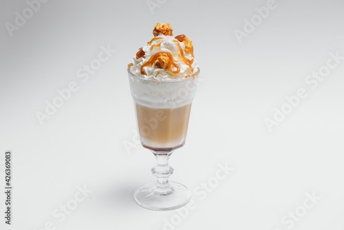 Tasty milk shake with chocolate topping on white background