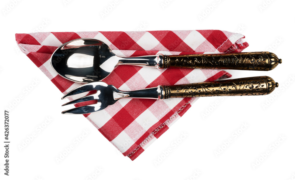 Fototapeta premium Set of cutlery on red cloth napkin on white background