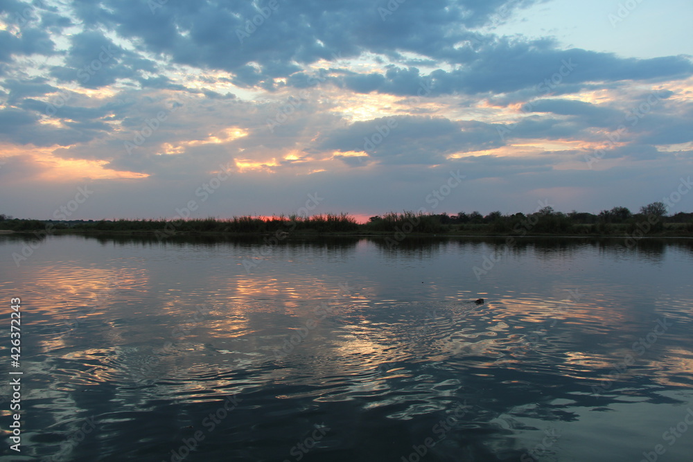 beautiful sunset at the okavango river in namibia beautiful sunset at the okavango river in namibia