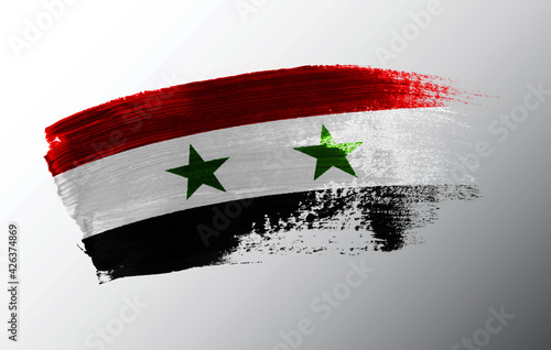 Syria flag illustrated on paint brush stroke
