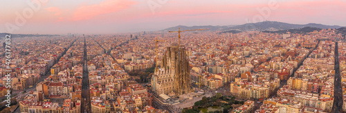 Barcelona, Spain - Feb 25, 2020: Aerial panorama drone shot of Barcelona city center empty street before sunrise at dusk