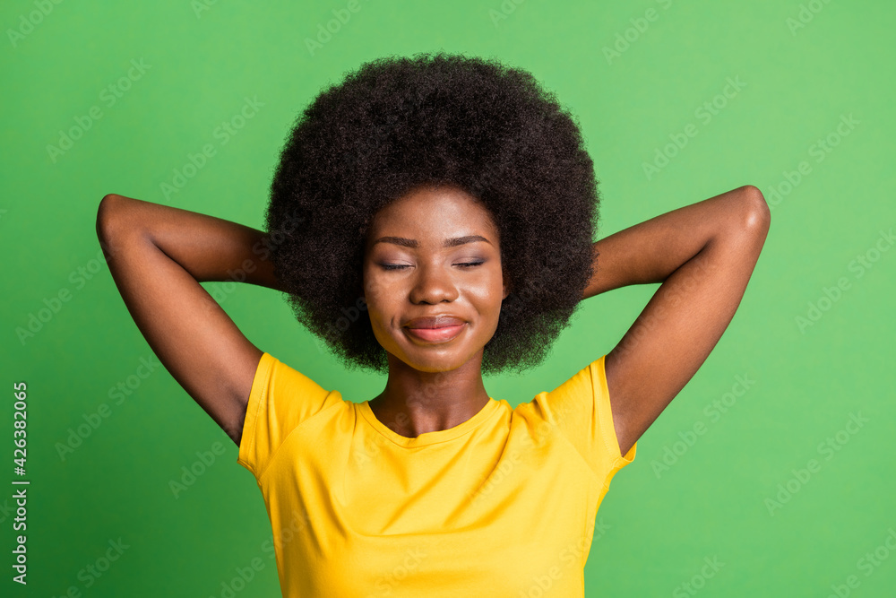 Top above high angle view photo of young beautiful lovely smiling afro girl daydreaming isolated on green color background Top above high angle view photo of young beautiful lovely smiling afro girl daydreaming isolated on green color background