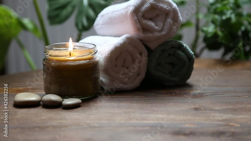 Spa candle and towels, wellness and spa background setting