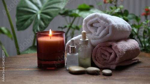 Spa still life with candle, skincare and bath towels, spa and wellness background