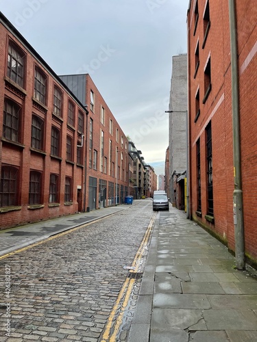 City street with buildings and a mixture of architecture styles. Taken in Manchester England. 