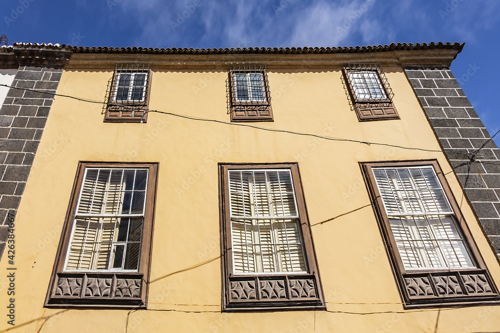 Fototapeta premium Typical Canary Island colourful architecture with wooden decorative elements on the island of Tenerife. San Cristobal de La Laguna, Tenerife, Canary Islands, Spain.