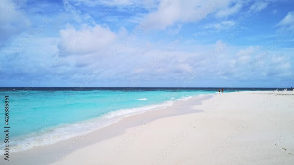 Beautiful turquoise water at paradise beach on Thulhagiri Island (Maldives)