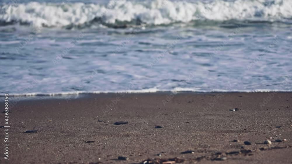 Slow motion ocean waves with focus shifting from foreground into the background Slow motion ocean waves with focus shifting from foreground into the background