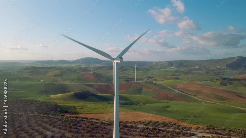 Aerial view of Ardales, south of Spain, with wind turbines, corn and olive fields at daytime Aerial view of Ardales, south of Spain, with wind turbines, corn and olive fields at daytime