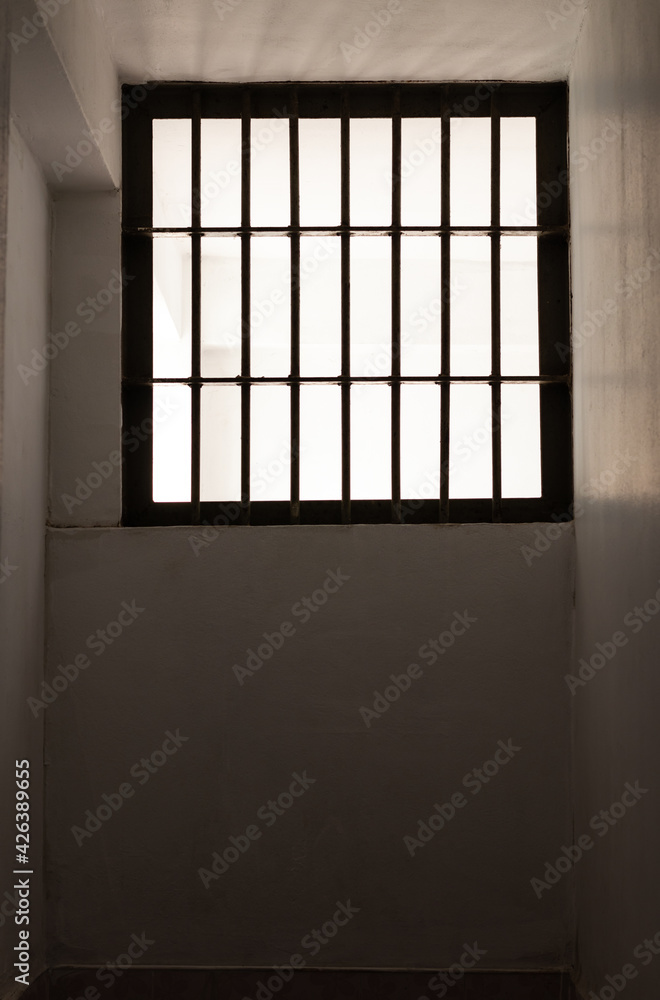Window grilles inside the old prison somewhere. Window grilles inside the old prison somewhere.