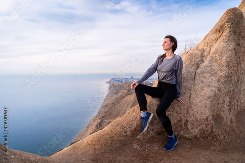 Bilde på lerret Woman looking on sunrise in the mountains